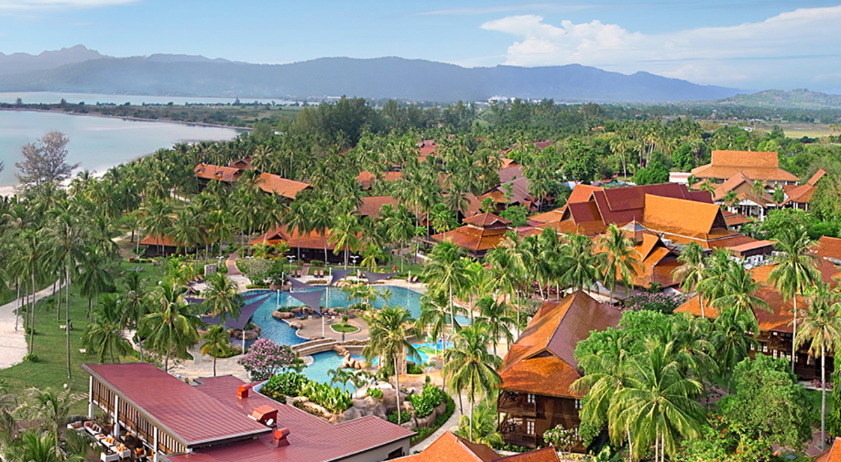 A wonderful Beach resort spa surrounded by palm trees and  Mountains in Langkawi. Malaysia