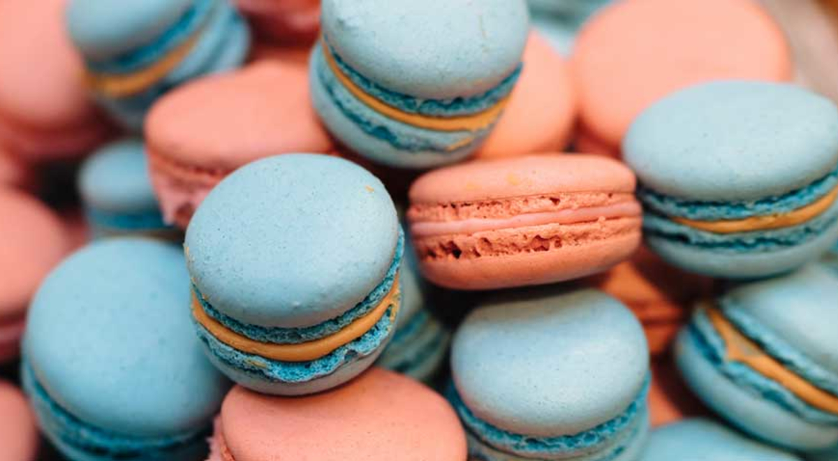 Close-up shot of pink and blue macarons