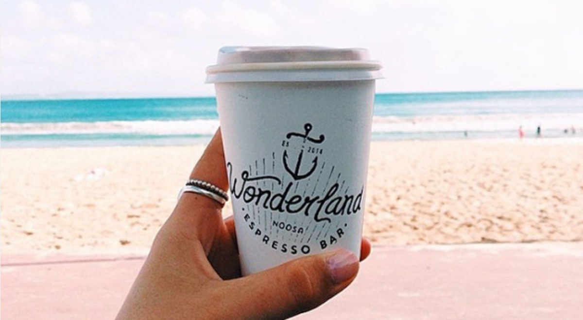 Cup of coffee with beach background