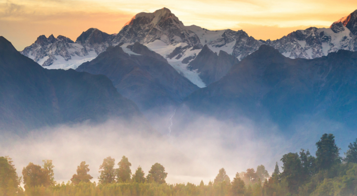 New Zealand snow capped mountains and trees 