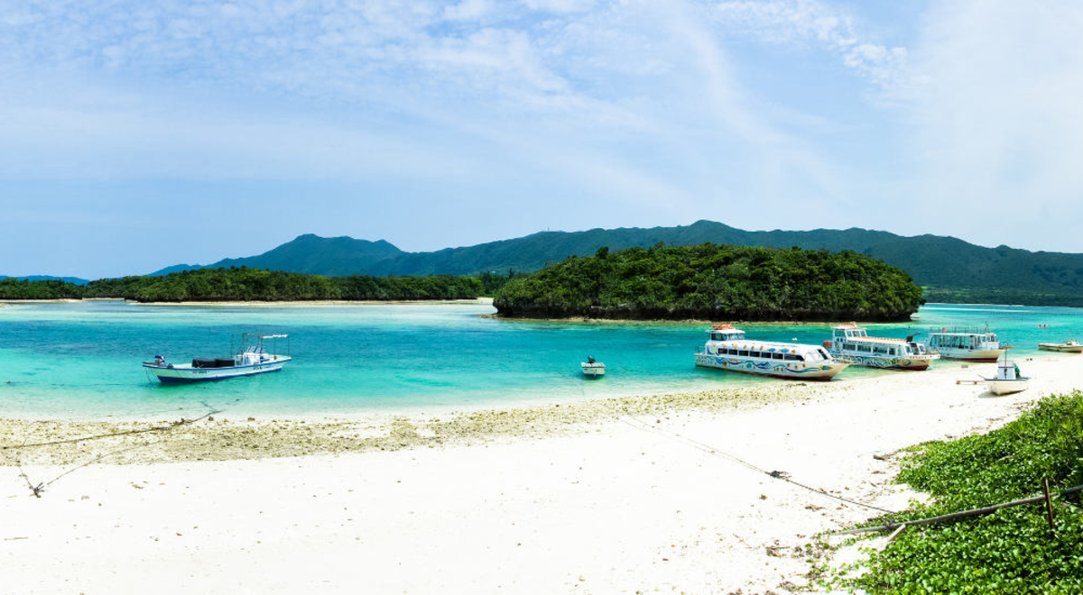 boats parked on the shore of the islands