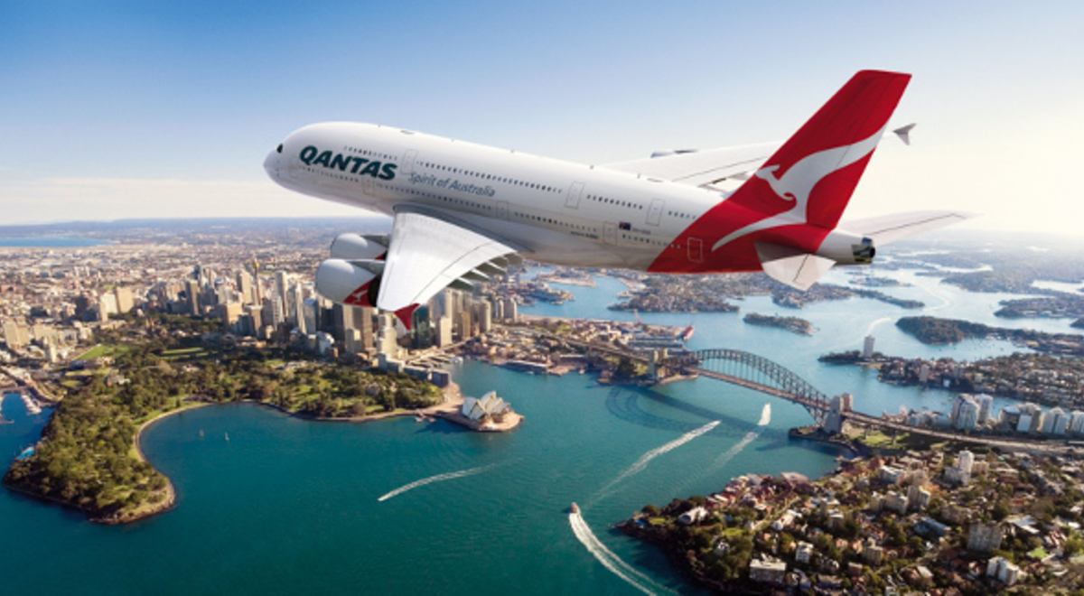 Qantas plane flying over the Sydney Harbour 
