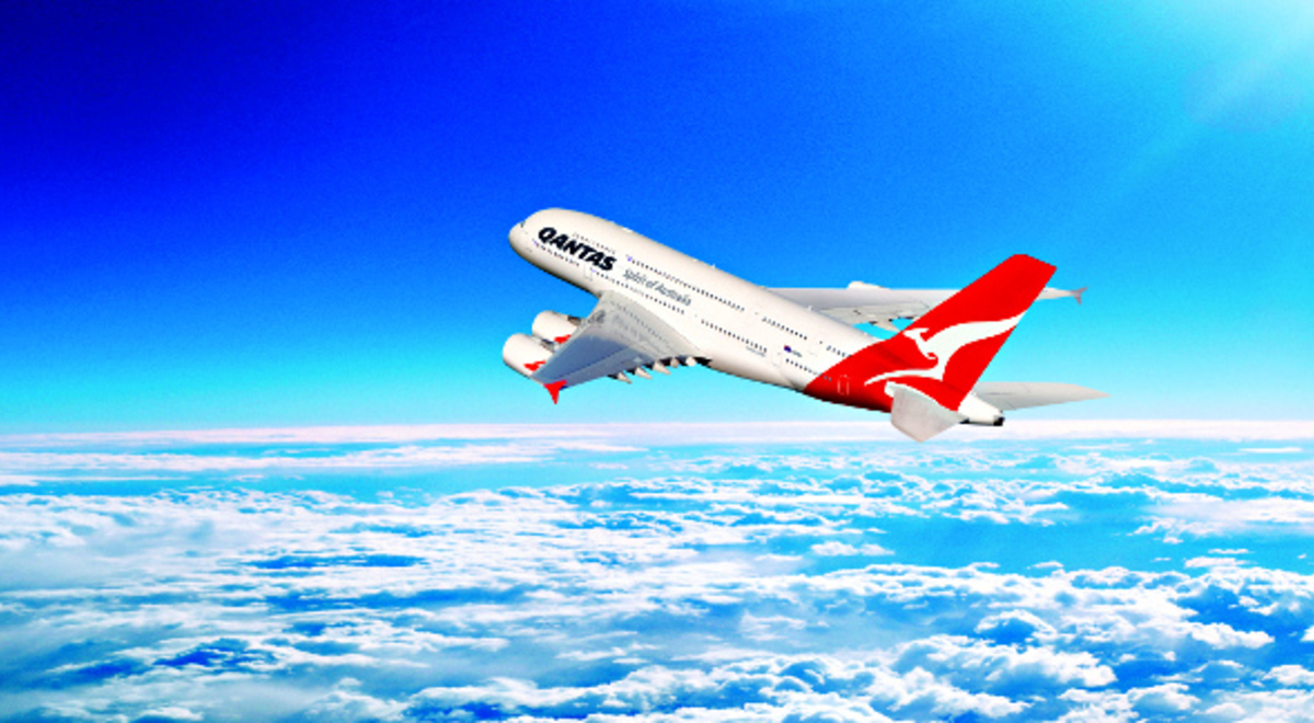 Qantas plane flying up in the clouds