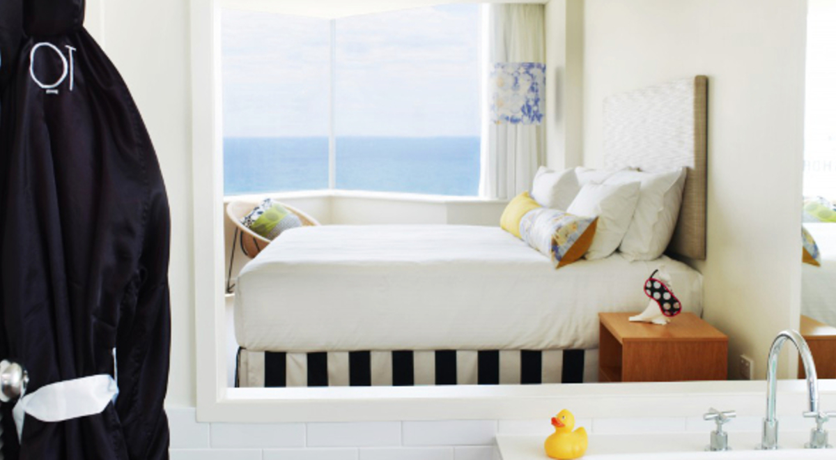2-person bedroom with windows overlooking the ocean