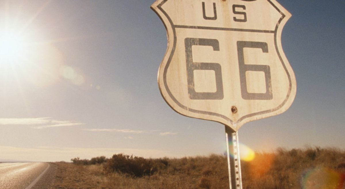 Route 66 road sign under the sun
