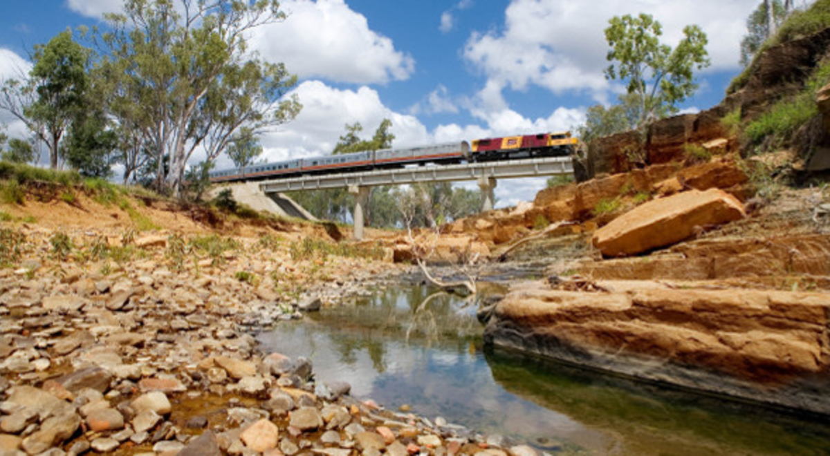 The Spirit of the Outback train crosses a creek in country Queensland