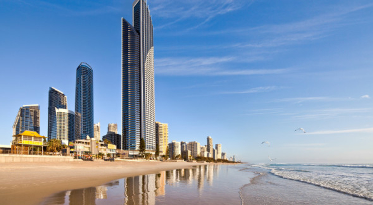 the towering buildings on the shore of a beach in the Gold Coast
