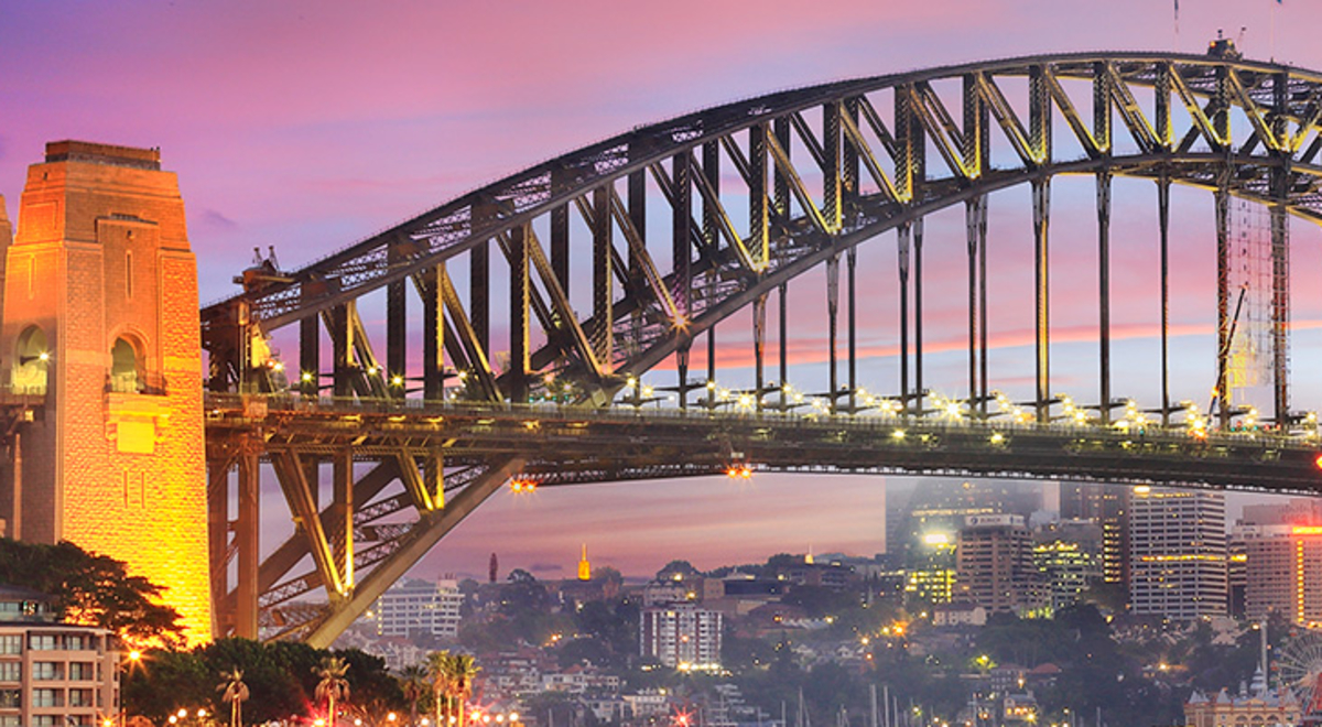 Sydney Harbour Bridge twinkles with lights at sunrise