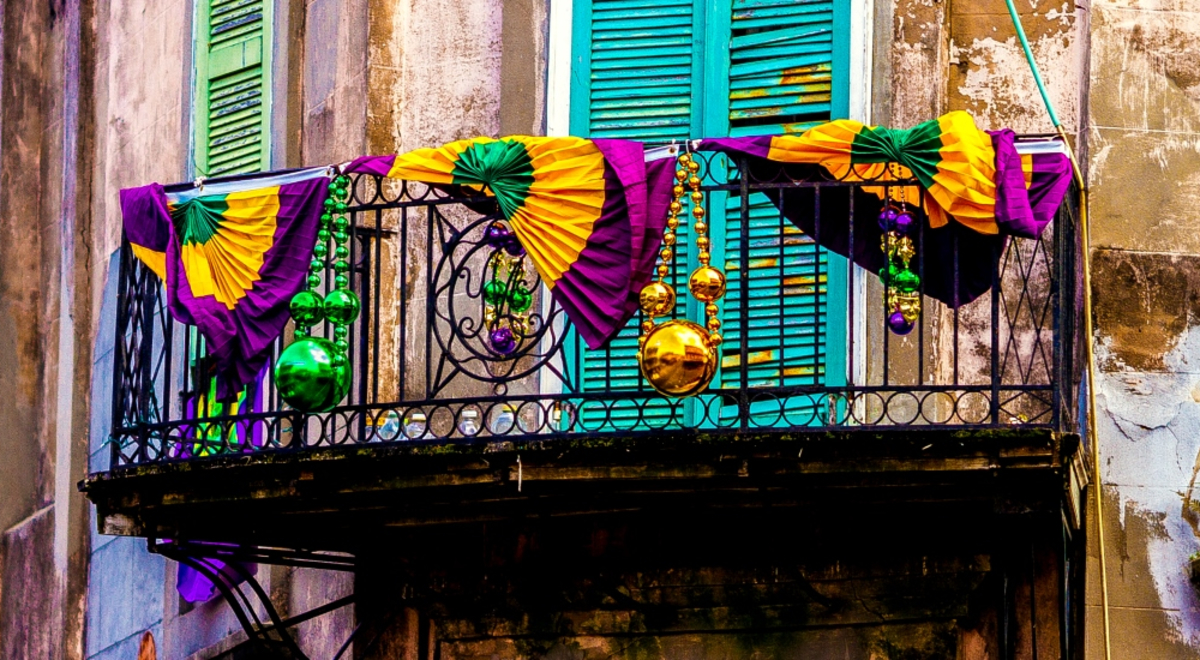 Colourful decorations hanging over balcony in old city street