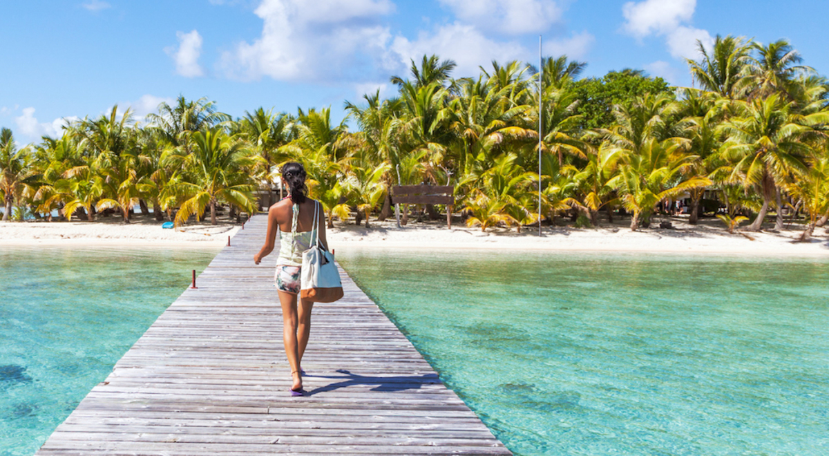 Woman walking on overwater pathway