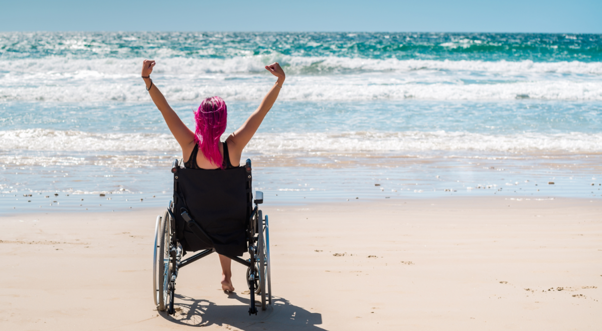 A woman in a wheelchair on a US beach