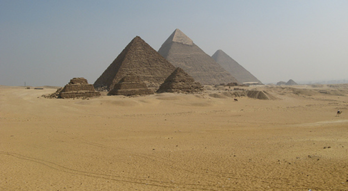 The pyramids of Egypt on a sandy plane 