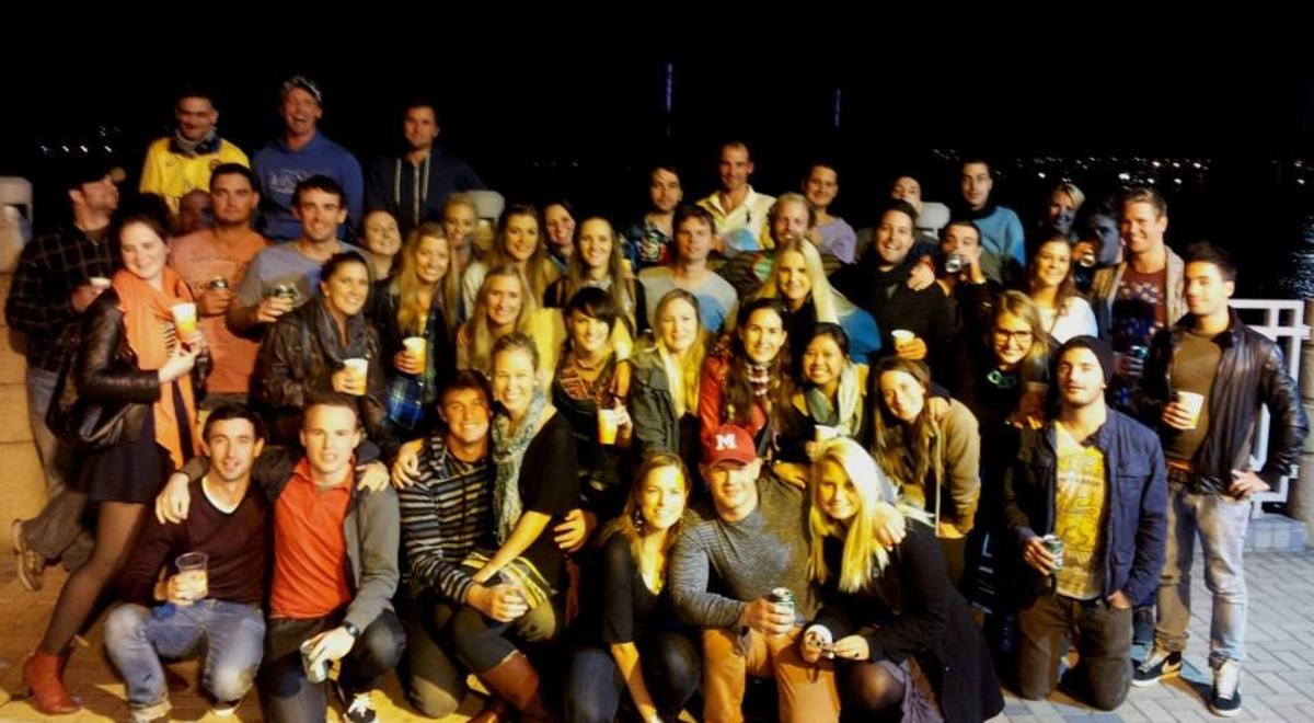 A large group photo at a birthday barbeque