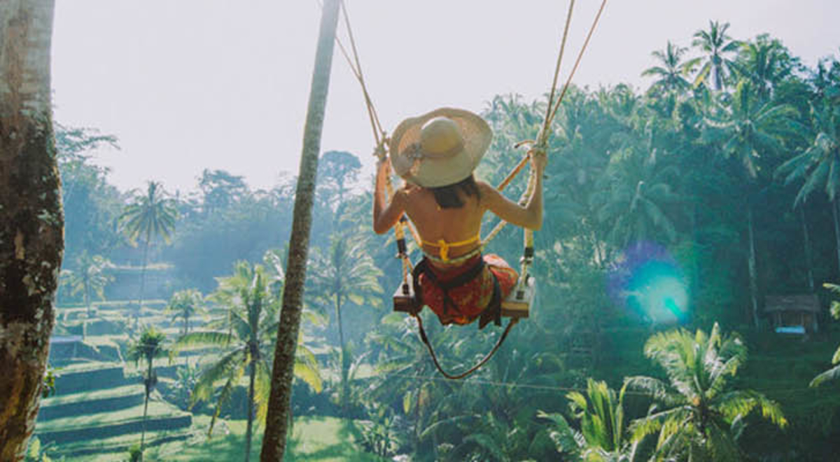 A person on a swing in Bali