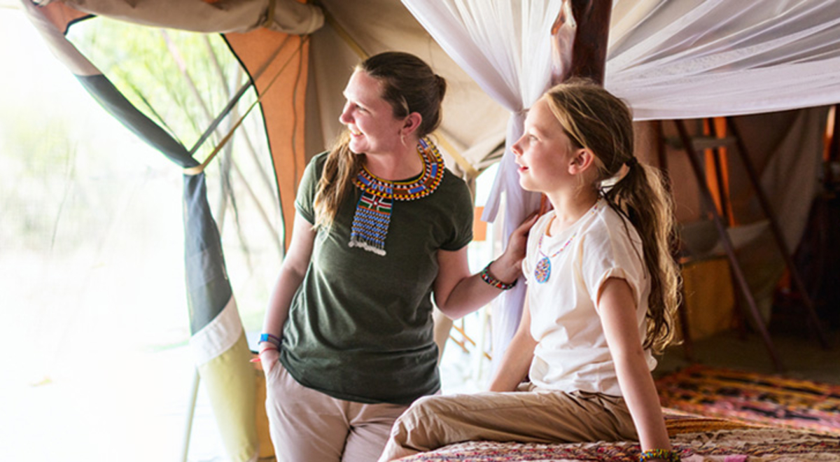 A mother and daughter in luxurious glamping accommodation