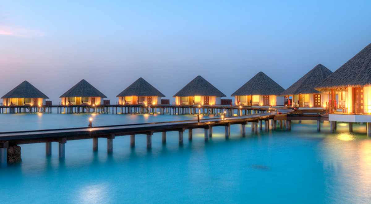 Overwater bungalows in the Maldives at sunset