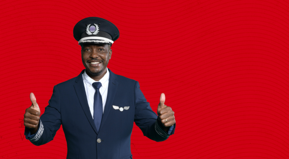 Flight Centre Captain with thumbs up on a red background