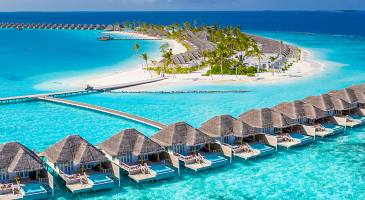 A view of oversea bungalows in the Maldives, which can be experienced with a holiday package from Flight Centre.
