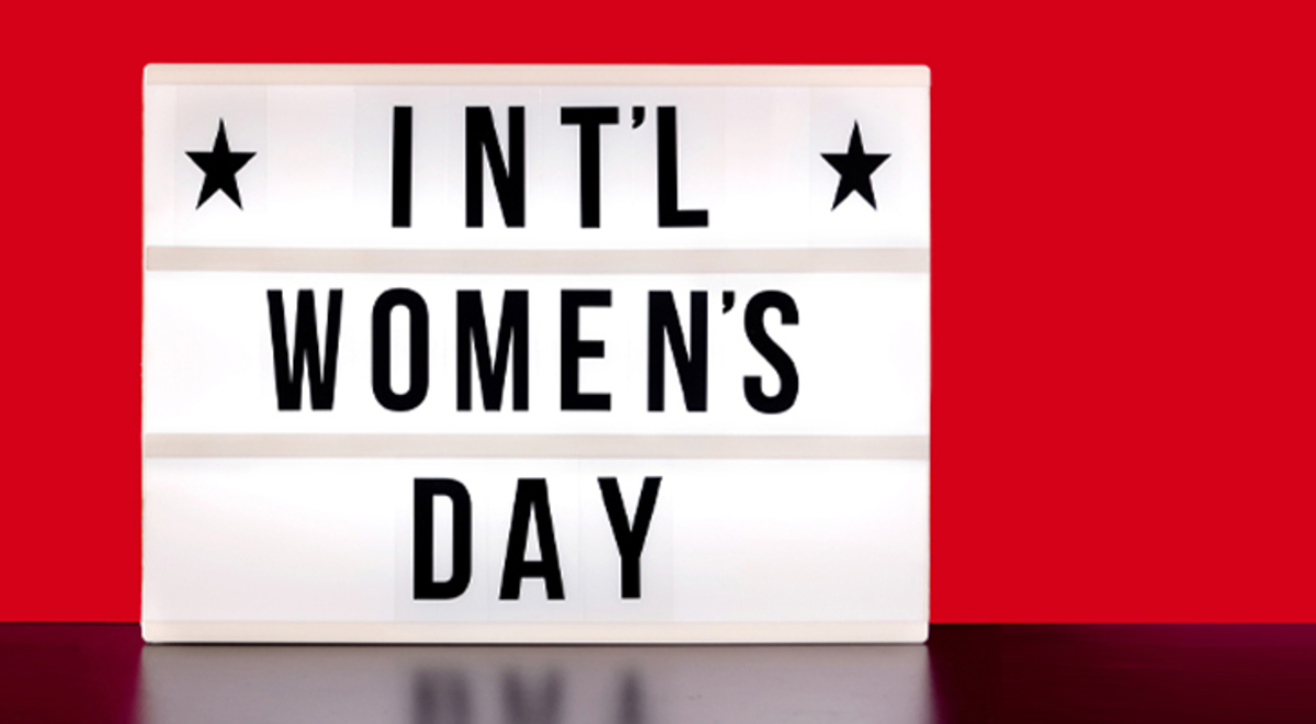 A white sign labelled int'l (international) women's day