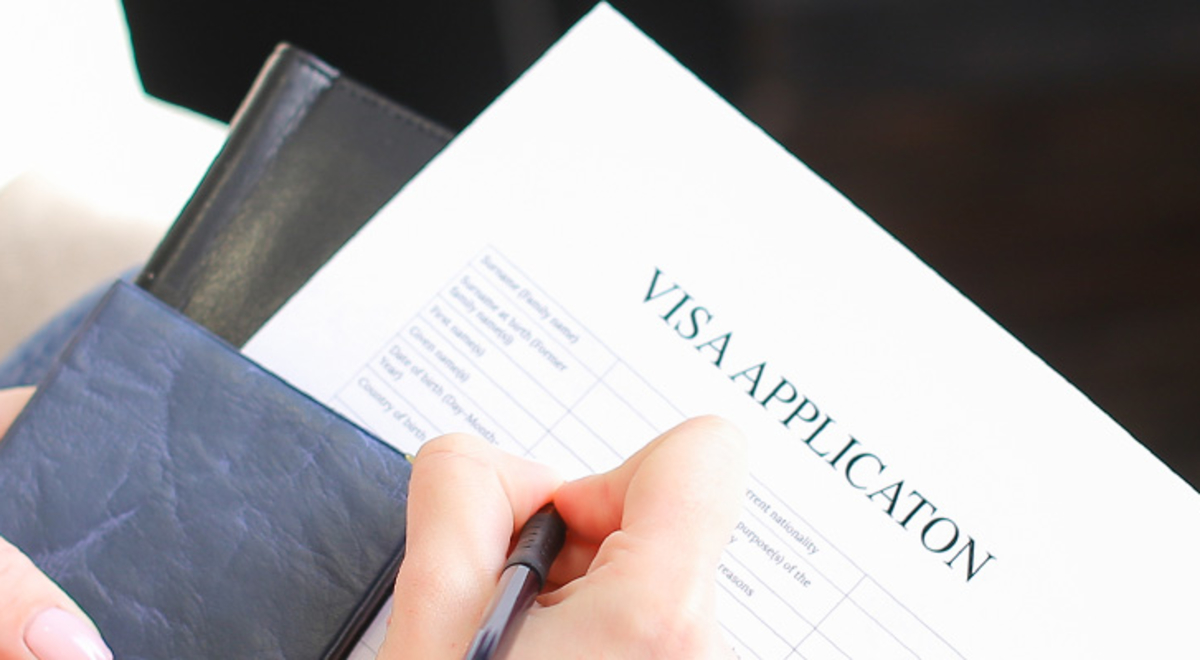 A person filling out a visa application