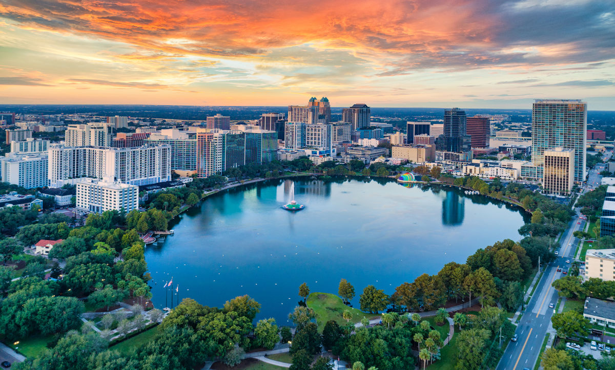 Lake Eola in Orlando under a orange & red sunset