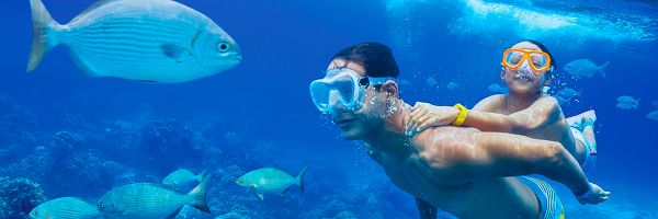 Son and father snorkelling