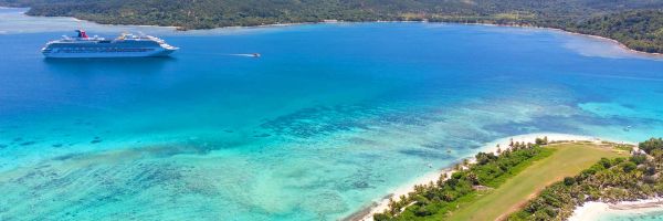 Drone shot of Carnival cruise ship docking at one of the South Pacific Islands