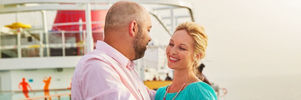 Two people onboard top deck of Carnival ship