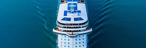 Drone shot of cruise ship in middle of ocean