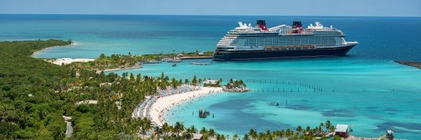 Disney Cruise Ship docked at a tropical island