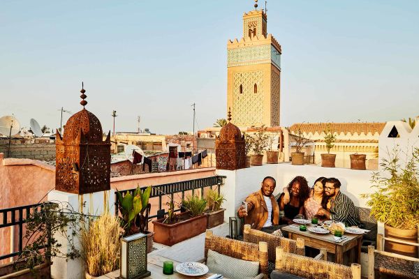Friends sitting at a roof-top restaurant