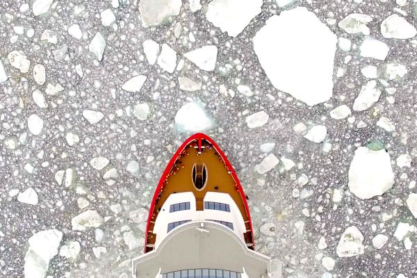 Hurtigruten ship surrounded by ice caps