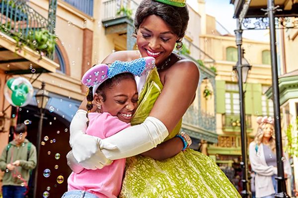 princess tiana hugging your girl at disneyworld in anaheim