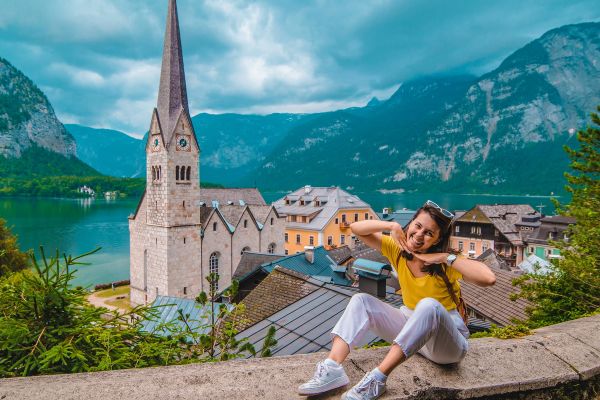 Woman sitting and enjoying the vie of hallstatt 