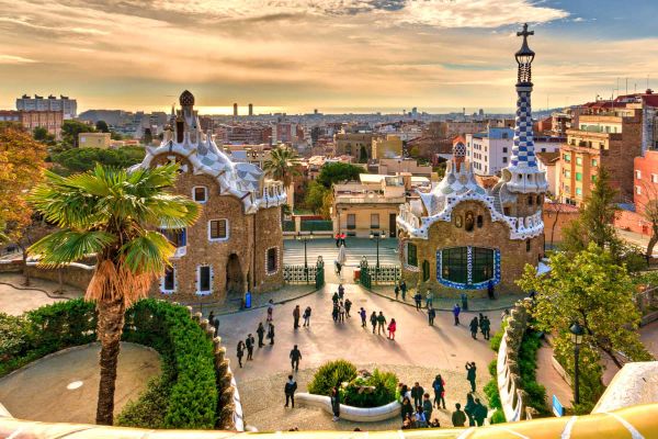 Colourful shot of Barcelona with the sun tucked behind clouds