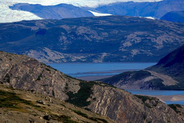 Mountainous range with lake in the distance