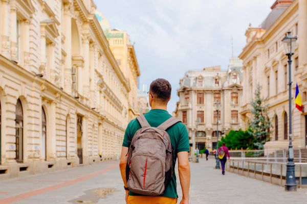 Man walking down a quiet street in a European city