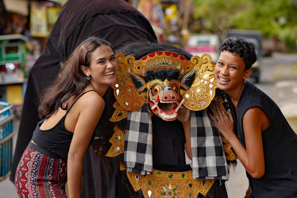 Two women posing with a Barong Bankal (Boar) costume in Thailand