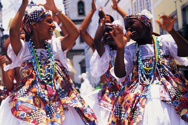Brazil, Salvador, female dancers in street clapping