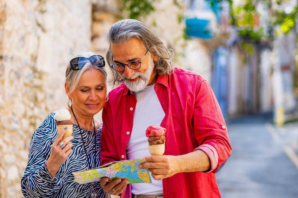Couple looking at map while eating gelato