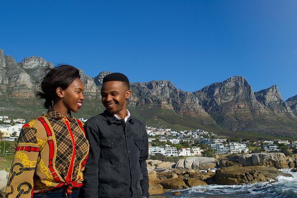 Two people smiling hands at lookout