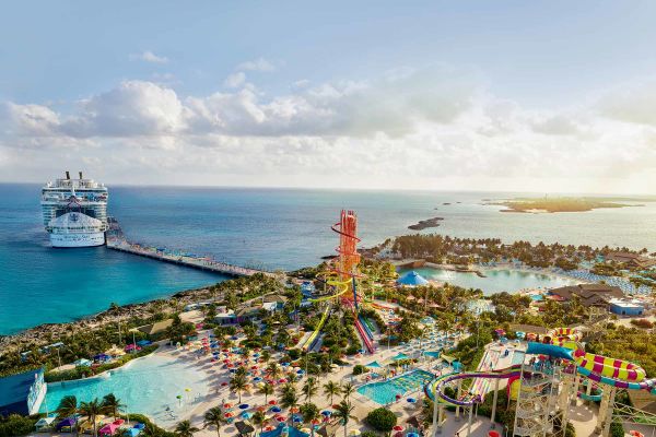 Cruise ship docked at island with water park