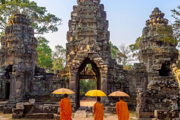 Buddhist monks walking inside Angkor Wat temple