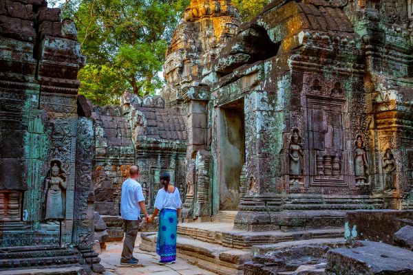 Adult couple visiting the temple ruins of Angkor, Cambodia