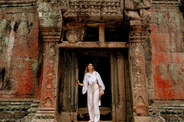 Traveler Exploring Ancient Ruins of Ta Prohm Temple at Angkor
