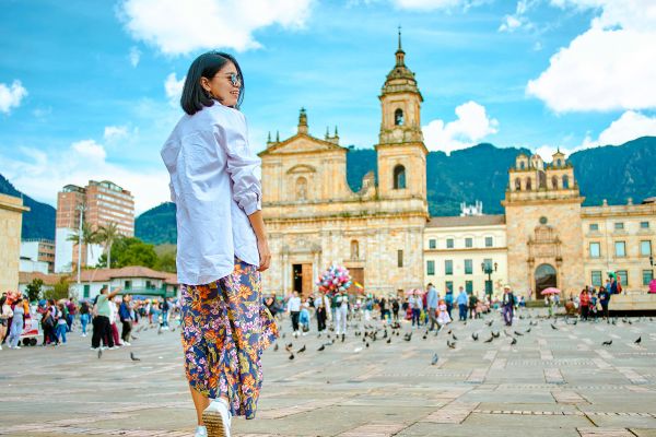 Woman walking in Bolivar square in Bogota
