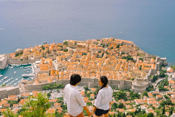 Two people at top of Dubrovnik looking at view