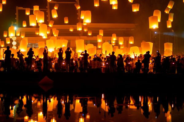 A lantern festival reflected in a lake at night