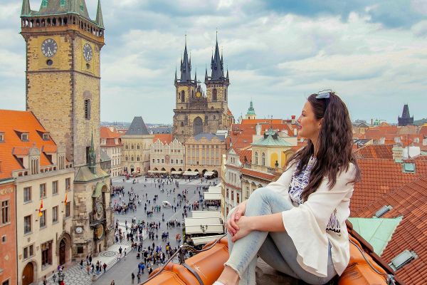 Happy tourist looking at the Old Town Square from above, Prague, Czech Republic