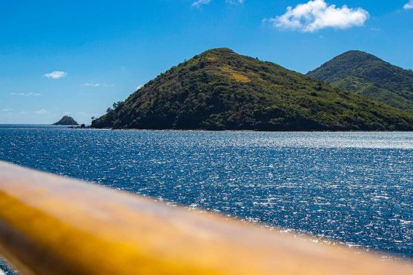 Deck railing with mountains in the background